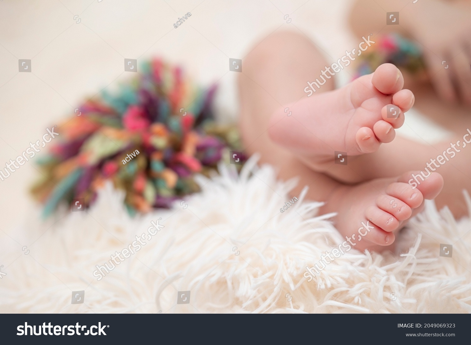 stock-photo-feet-of-a-newborn-baby-and-a-pompom-in-the-background-2049069323 (1).jpg